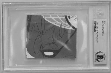 Glen Campbell Autographed 2"x2" Cut Signature- Beckett/BAS Encapsulation #00011552200 (Country Music Legend)-Powers Sports Memorabilia