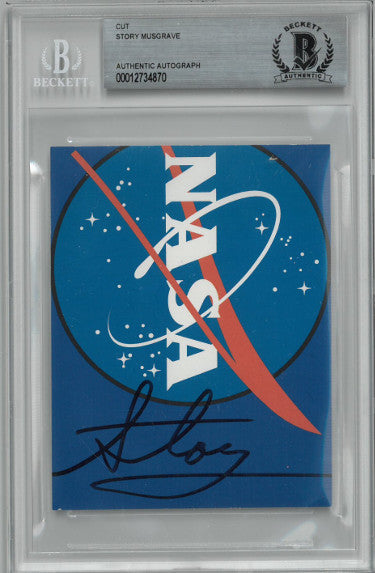 Story Musgrave Autographed 3.5x4.5 Cut Signature- Beckett Encapsulated (NASA Astronaut Apollo/STS Space Shuttle Missions)-Powers Sports Memorabilia