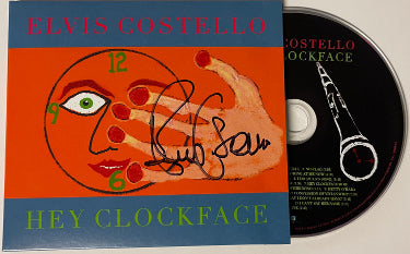 Elvis Costello Autographed 2020 Hey Clockface Album Hard Cover Booklet w/ CD (English/British Singer-Songwriter)-Powers Sports Memorabilia