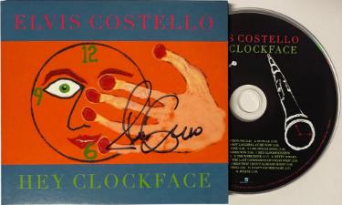 Elvis Costello 2020 Hey Clockface Album Hard Cover Booklet w/ CD- COA (English/British Singer-Songwriter) - Autographed-Powers Sports Memorabilia