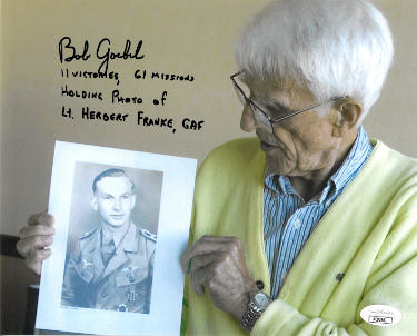 Robert "Bob" Goebel Autographed WWII Color 8x10 Photo- JSA #AC92661- Holding Photo of Lt. Herbert Franke, GAF/11 Victories/61 Mission-Powers Sports Memorabilia