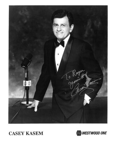 Casey Kasem Autographed B&W 8x10 Photo-To Roger, Your #1 (Top 40/Shaggy Rogers Scooby-Doo/Radio)- COA-Powers Sports Memorabilia