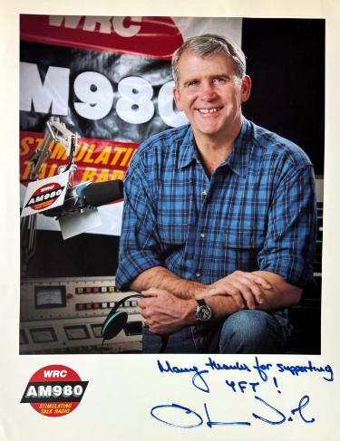 Oliver North Autographed WRC AM 980 Radio 8.5x11 Photo dings- COA (Iran?ÇôContra)-Powers Sports Memorabilia