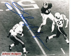 Johnny Rodgers Autographed Nebraska Cornhuskers B&W 8x10 Photo (Heisman) (blue sig)-Powers Sports Memorabilia