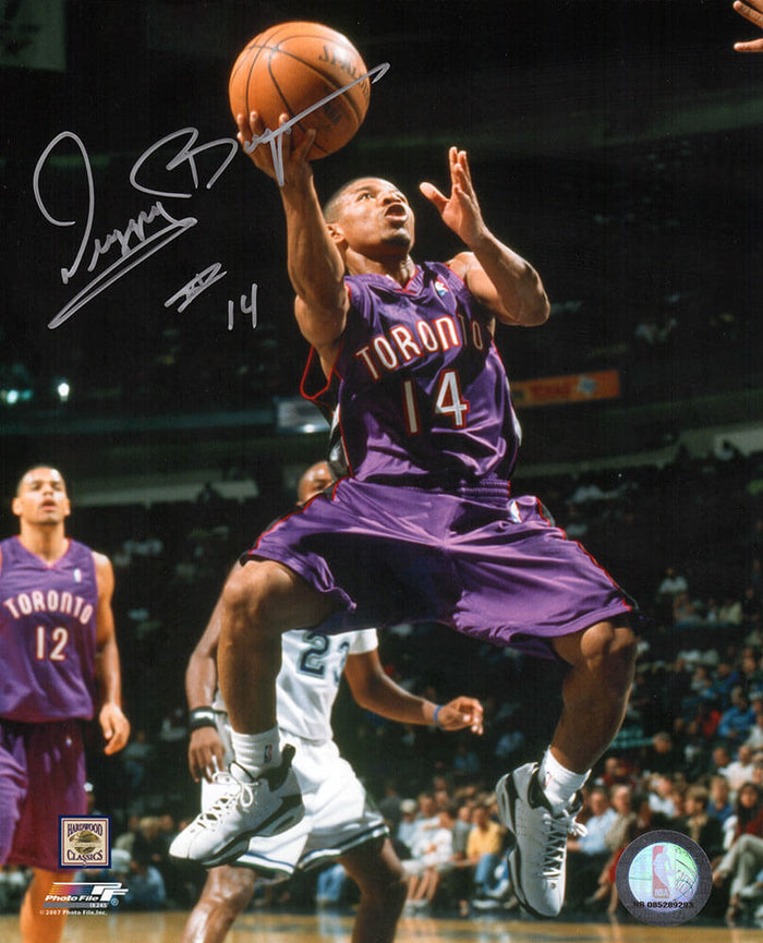Muggsy Bogues Autographed Toronto Raptors Purple Jersey Action 8x10 Photo-Powers Sports Memorabilia