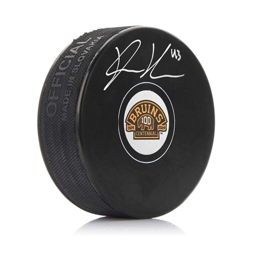 Danton Heinen Signed Boston Bruins 100th Anniversary Hockey Logo Puck-Powers Sports Memorabilia