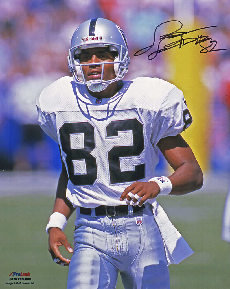 James Jett Las Vegas Raiders Autographed White Jersey Running 8x10 Photo-Powers Sports Memorabilia