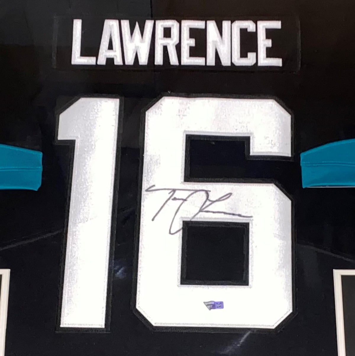 Autographed Trevor Lawrence Jacksonville Jaguars (Black #16) Nike Deluxe Framed Jersey - Fanatics-Powers Sports Memorabilia
