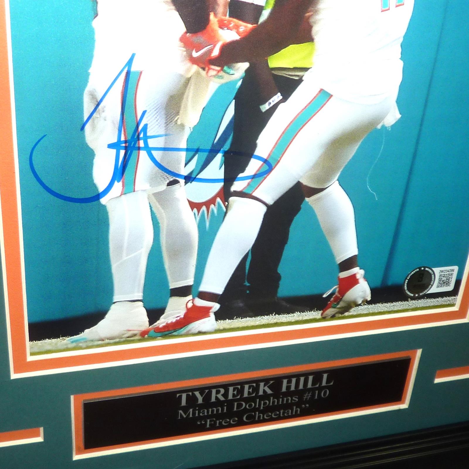 Autographed Tyreek Hill Miami Dolphins (Handcuffs Celebration Color) Deluxe 8x10 Photo - Beckett-Powers Sports Memorabilia