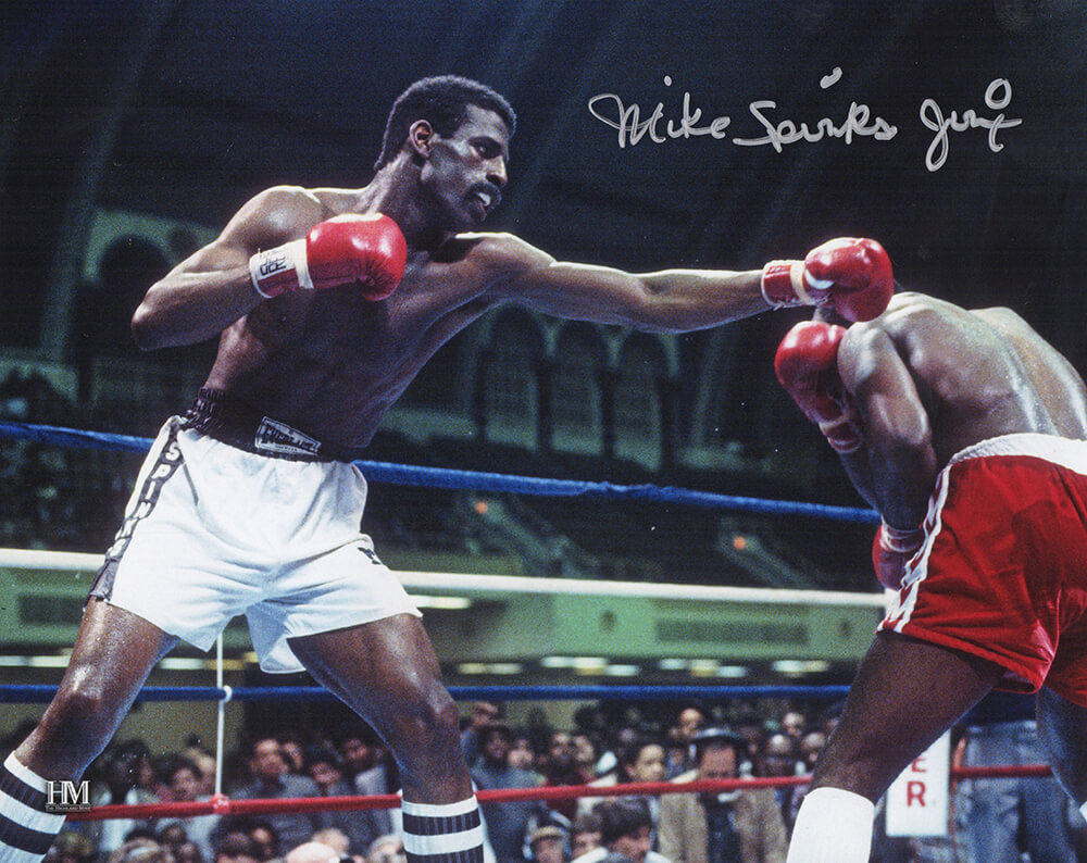 Michael Spinks Autographed Boxing Punching Action 8x10 Photo with Jinx-Powers Sports Memorabilia