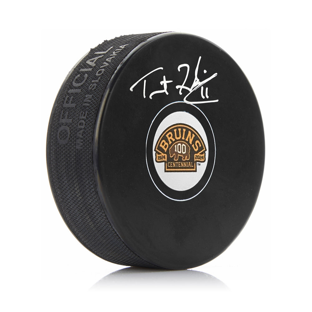 Trent Frederic Signed Boston Bruins 100th Anniversary Hockey Logo Puck-Powers Sports Memorabilia