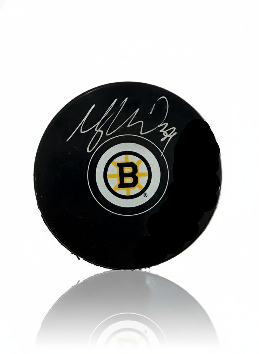 Morgan Geekie Boston Bruins Signed 2025 Logo Puck-Powers Sports Memorabilia